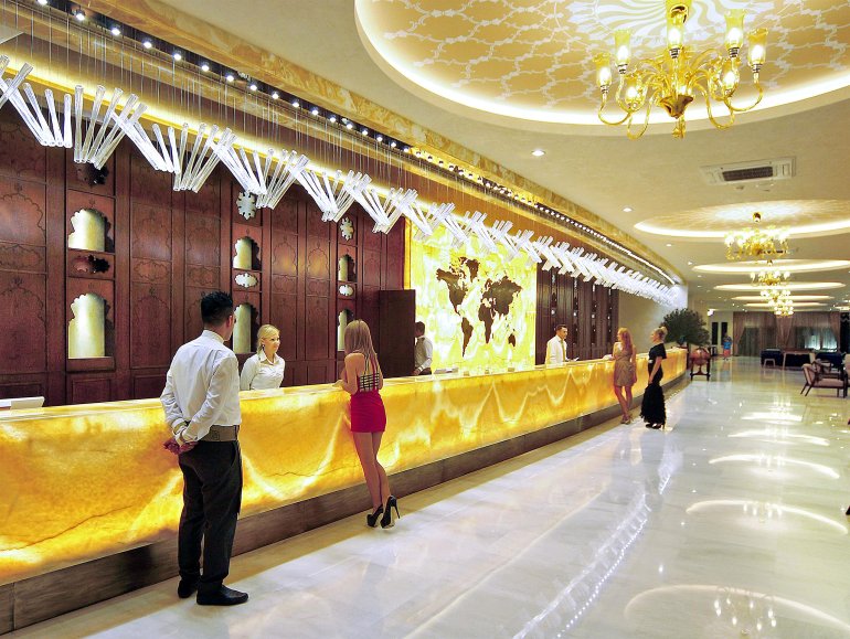 A girl in a pink mini dress takes a loan to play at the casino Trump Taj Mahal